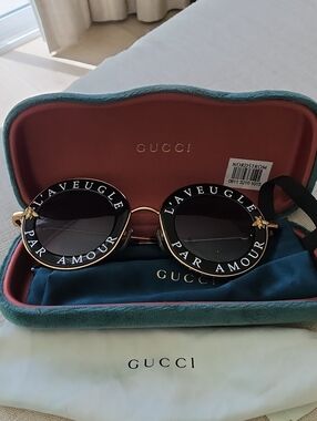 Gucci Black Round 'L'AVEUGLE PAR AMOUR' Sunglasses with Gold Accents